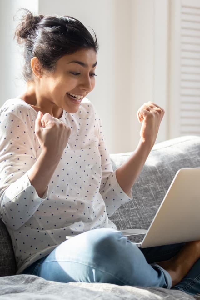 girl celebrating her academic success by pumping her fists